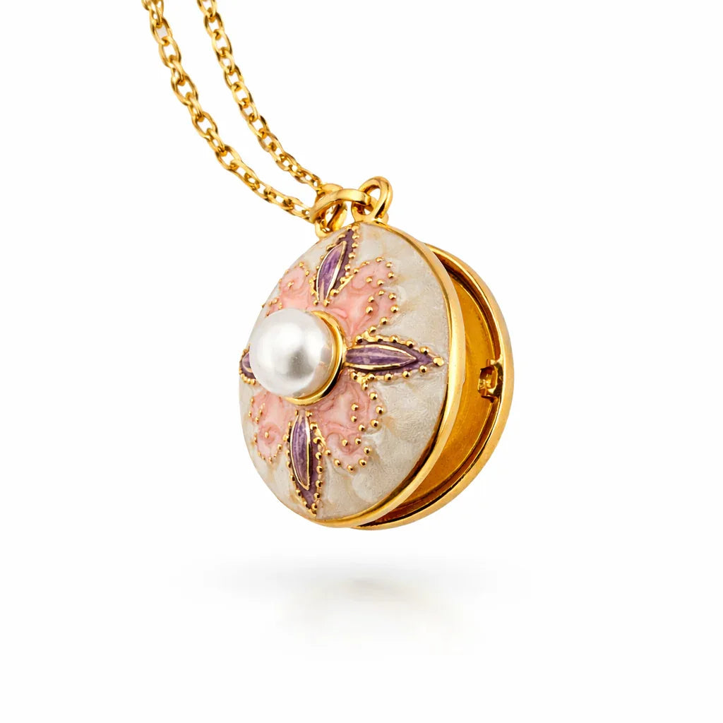 Jinam Pearl Center Designer Locket Pendant set featuring a silver-tone pendant with a central pearl and intricate detailing.