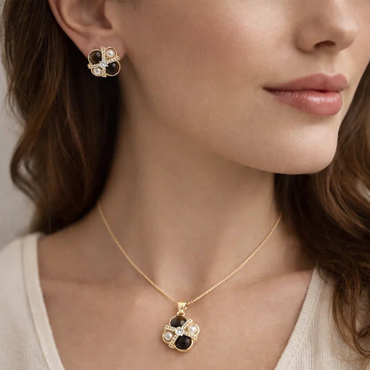 Gold-plated tiger eye and pearl pendant necklace set with CZ crisscross design, featuring a Jinam pendant set on a delicate chain.
