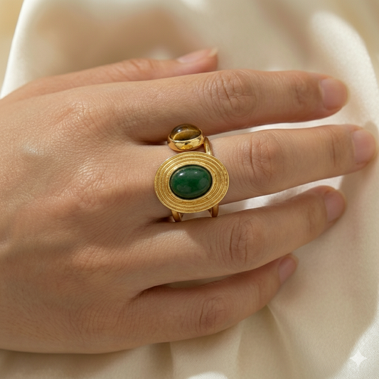 Jinam dual stone open adjustable statement ring featuring two stones and a modern, open design in silver-tone metal.