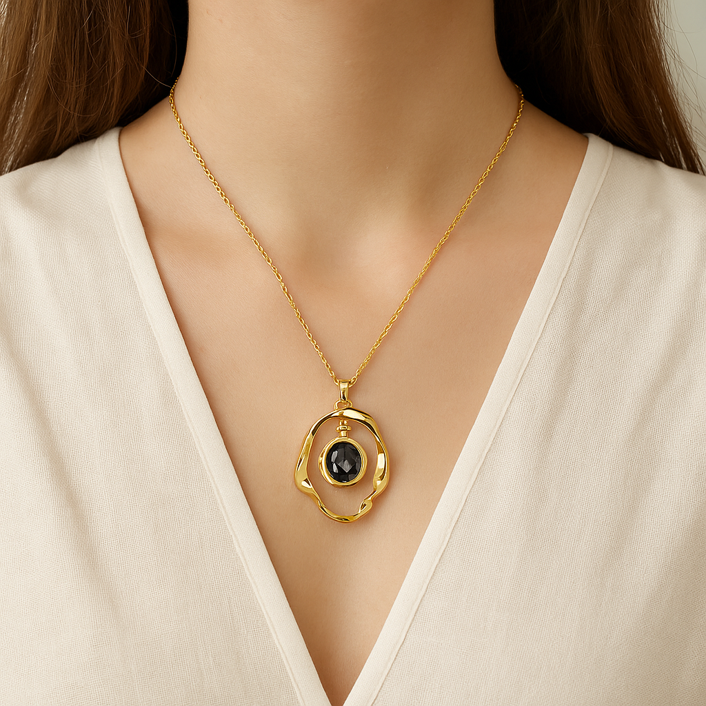 Jinam black crystal pendant necklace set with gold plating, anti-tarnish finish, featuring a sleek pendant design and matching chain.