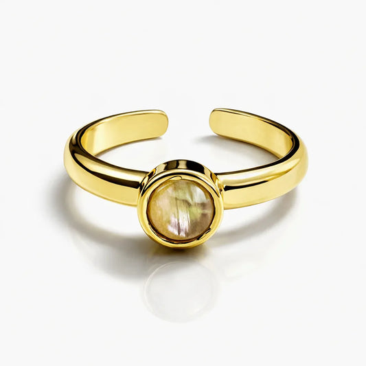 Gold-tone adjustable ring by Jinam featuring a natural iridescent shell stone, minimalist design with sleek, modern style.