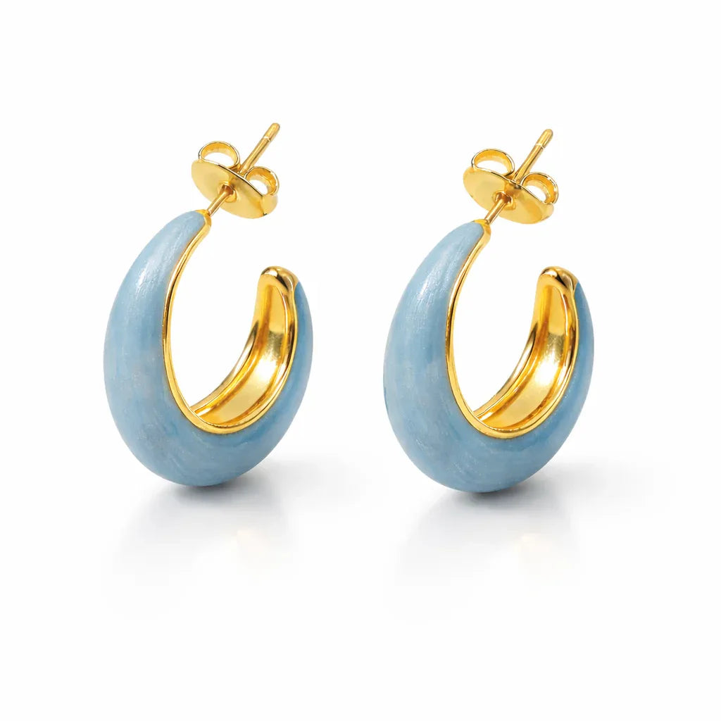 Blue enamel chunky hoop earrings by Jinam, showcasing bold round hoops with vibrant blue enamel finish.