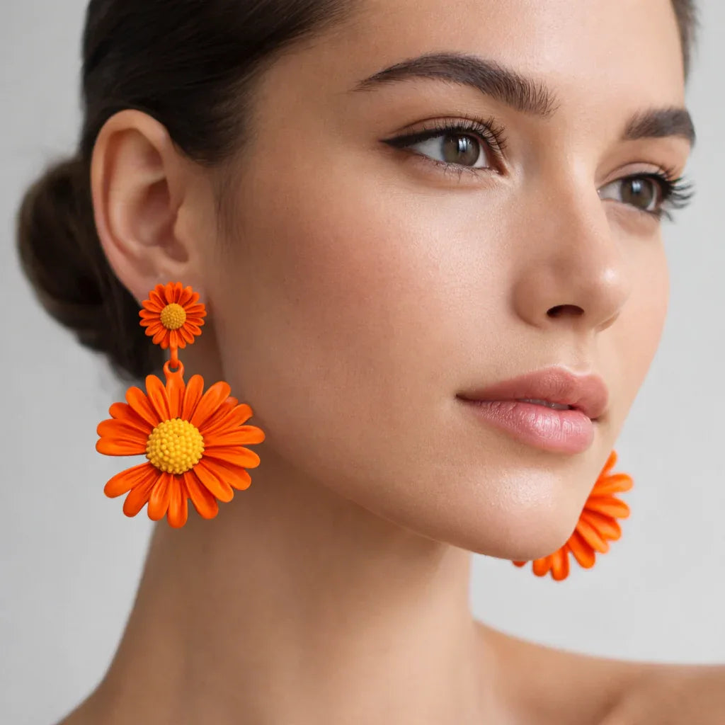 Orange Daisy floral drop earrings by Jinam featuring vibrant flower design and dangling style.