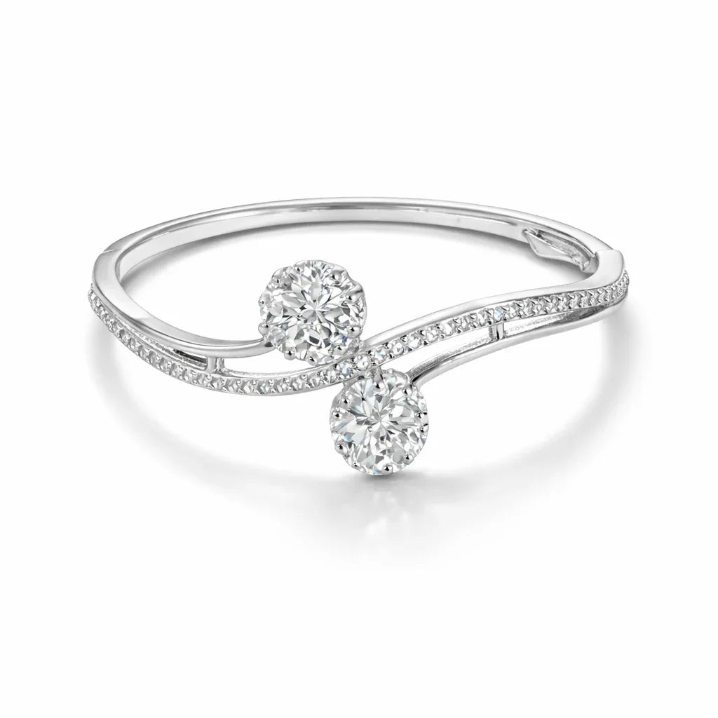Silver-plated Jinam bracelet with dual floral CZ accents, featuring intricate design and sparkling gemstone details.