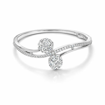 Silver-plated Jinam bracelet with dual floral CZ accents, featuring intricate design and sparkling gemstone details.
