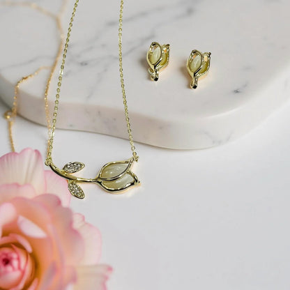 Gold-plated floral bud pendant and earrings set by Jinam, featuring delicate flower designs on matching jewelry pieces.