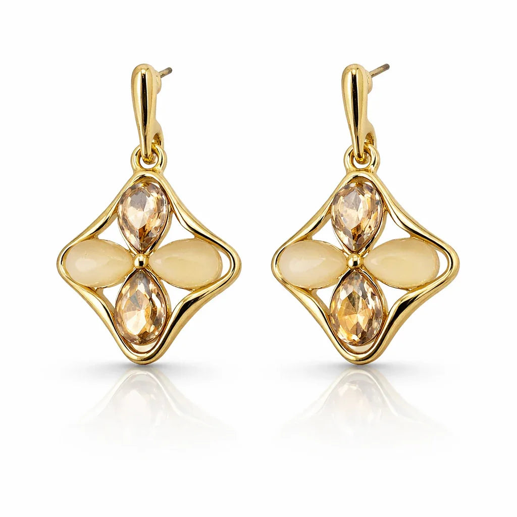 Elegant floral quad-petal pendant and earrings set by Jinam, featuring delicate flower designs with gold-tone metal.