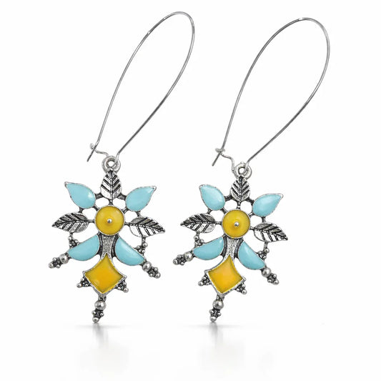 Colorful enamel dangler earrings by Jinam with pearl drops, featuring vibrant patterns and shiny metal hooks.