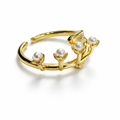 Jinam Golden Bloom Pearl Branch adjustable ring featuring a delicate floral design with gold-tone and pearl accents.