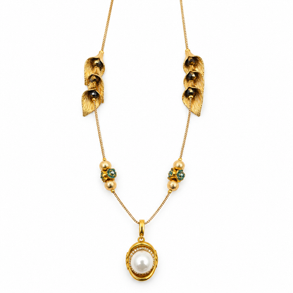 Gold Calla Lily Leaf Necklace close up showing pearl pendant and teal bead clusters on white background