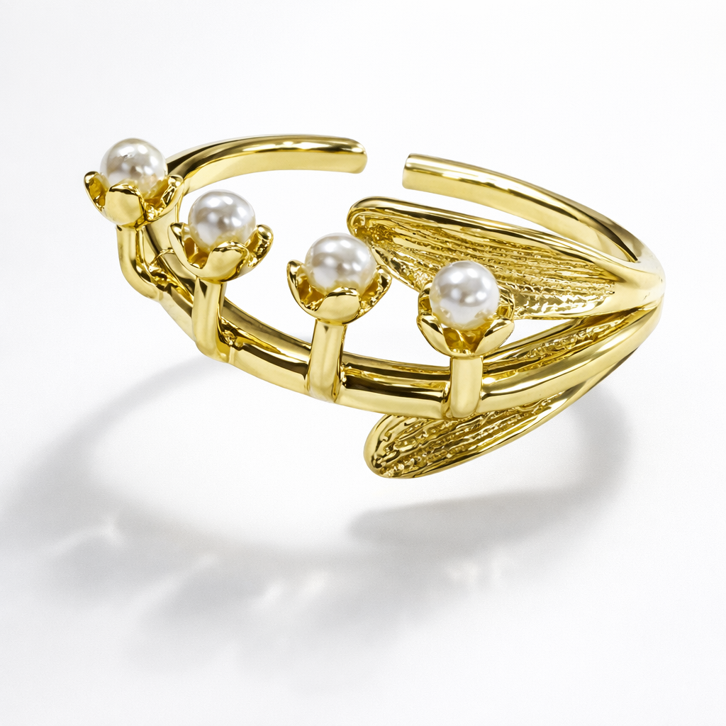 Jinam Golden Bloom Pearl Branch adjustable ring featuring a delicate branch design with pearl accents on a gold-tone band.