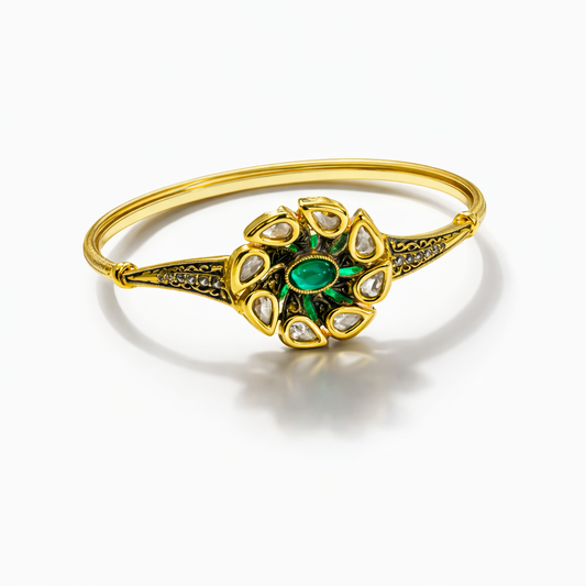 Antique gold-plated Kundan and emerald-style statement bracelet with intricate design, jewelry by Jinam.