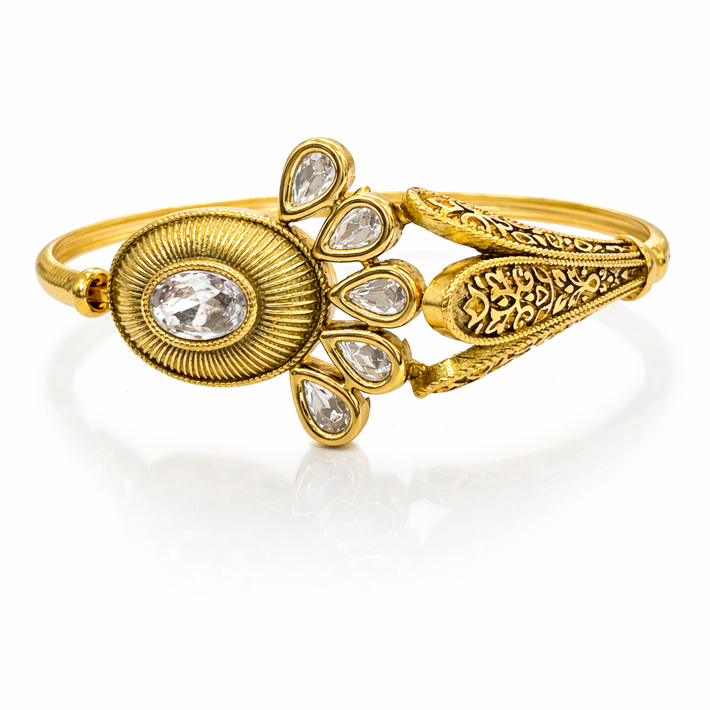 Jinam Royal Kundan Bloom Gold Bracelet with intricate floral design and sparkling gemstones on a delicate gold band.