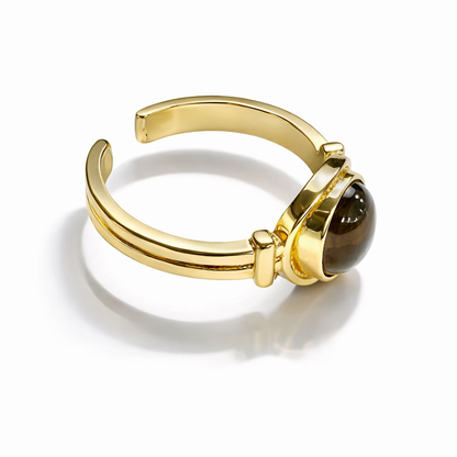 Vintage tiger eye oval adjustable ring by Jinam with a smooth polished gemstone and silver-toned band.