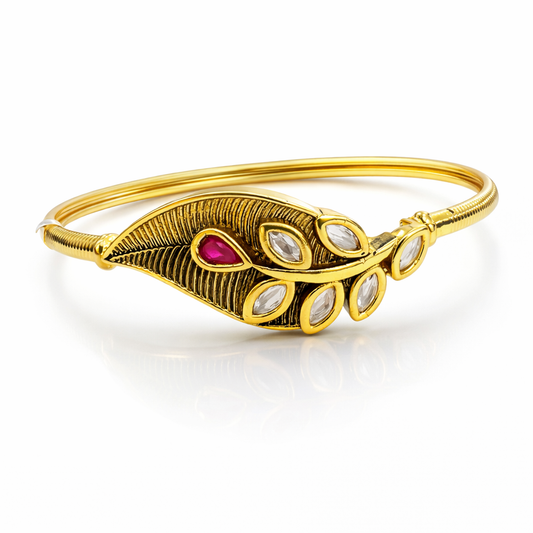 Gold-plated leaf motif Kundan bracelet with intricate design, showcasing elegant craftsmanship by Jinam.