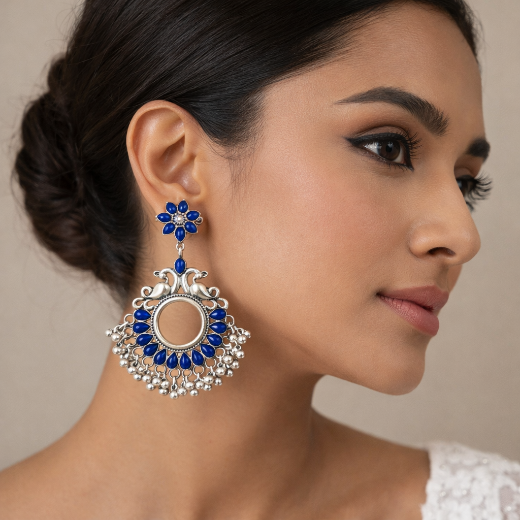 Oxidised silver blue floral earrings with bird motif by Jinam, featuring intricate design and elegant craftsmanship.