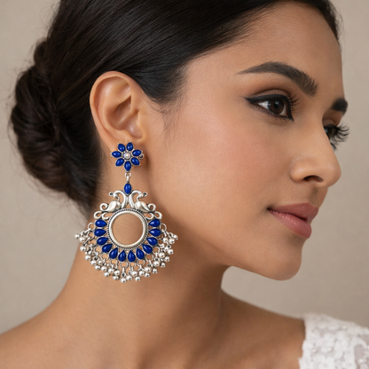 Oxidised silver blue floral earrings with bird motif by Jinam, featuring intricate design and elegant craftsmanship.