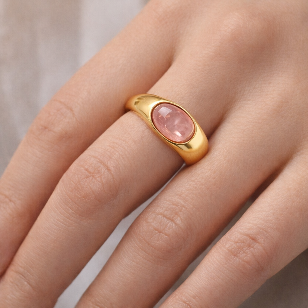 Pink stone statement gold ring by Jinam featuring an adjustable band and bold, eye-catching design.