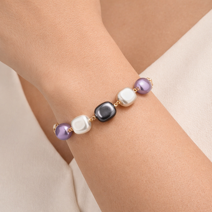 Jinam chic multicolour pearl chain bracelet featuring vibrant beads and elegant design on a neutral background.