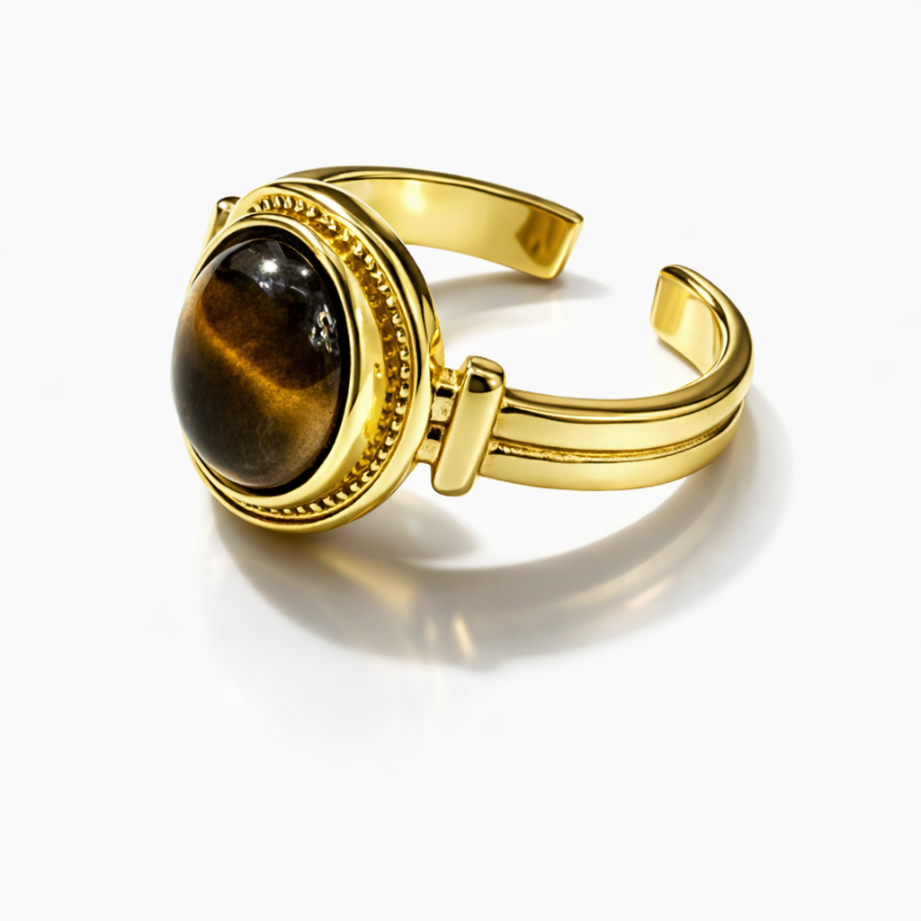 Vintage Tiger Eye oval adjustable ring by Jinam featuring a polished tiger eye gemstone set in a silver-toned band.