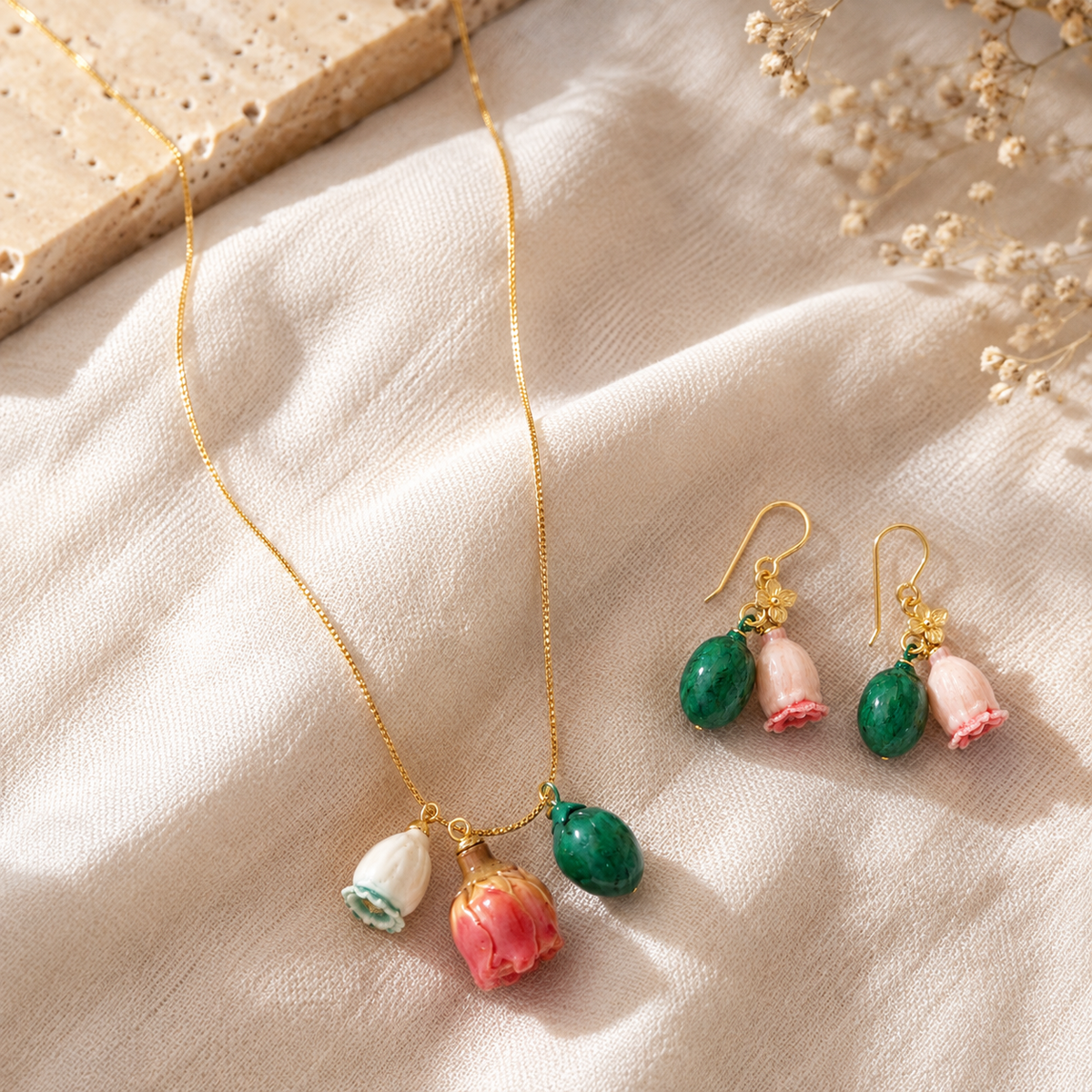 Floral Charm Necklace and Earrings flat lay on white