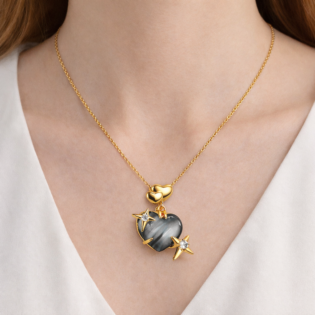 Jinam Midnight Heart Stone Star pendant set featuring a dark heart-shaped stone with star accents on a chain.