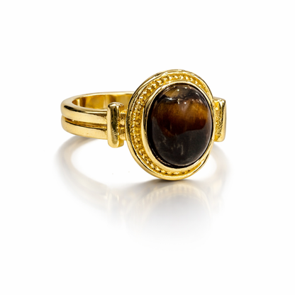 Vintage tiger eye oval adjustable ring by Jinam featuring a polished tiger eye gemstone on a silver-toned band