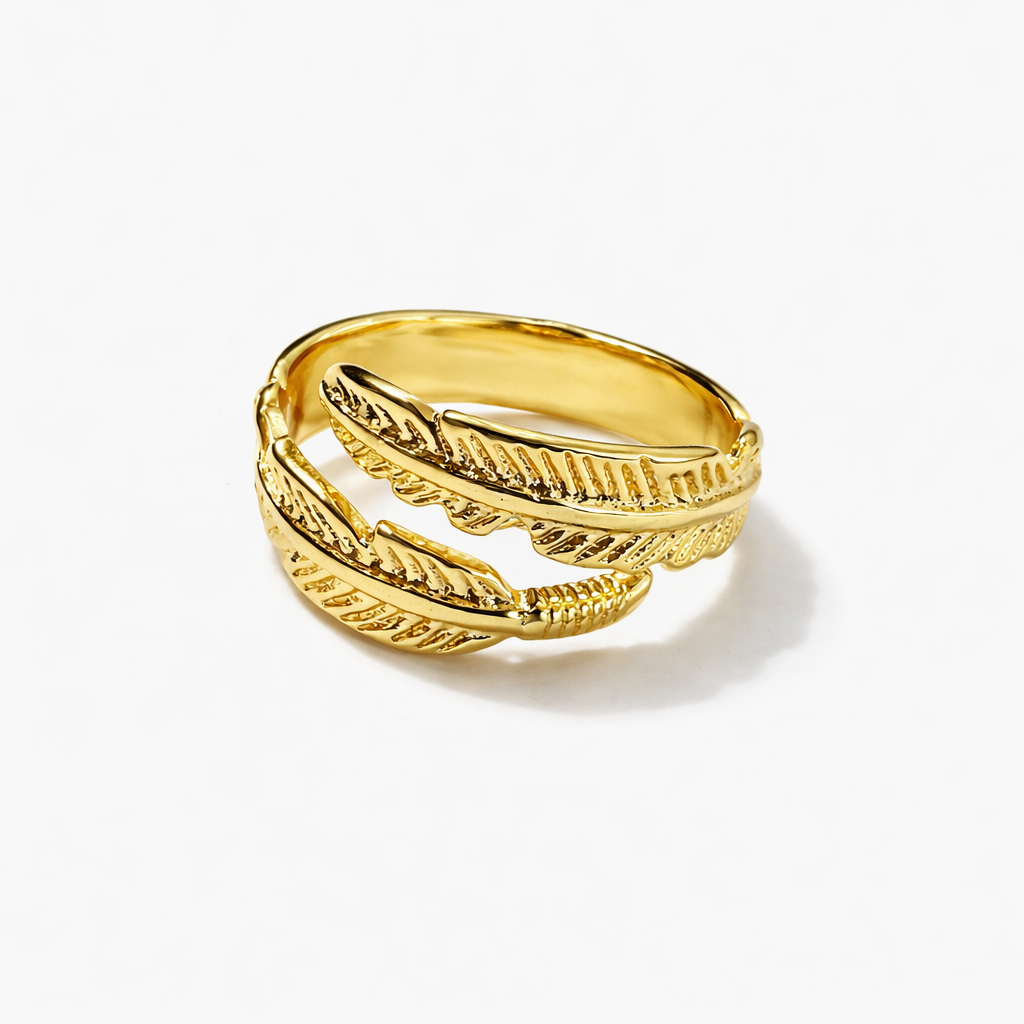 Jinam gold feather bracelet and ring set featuring elegant, nature-inspired jewelry with detailed feather designs.
