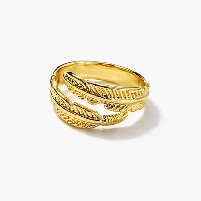 Jinam gold feather bracelet and ring set featuring elegant, nature-inspired jewelry with detailed feather designs.