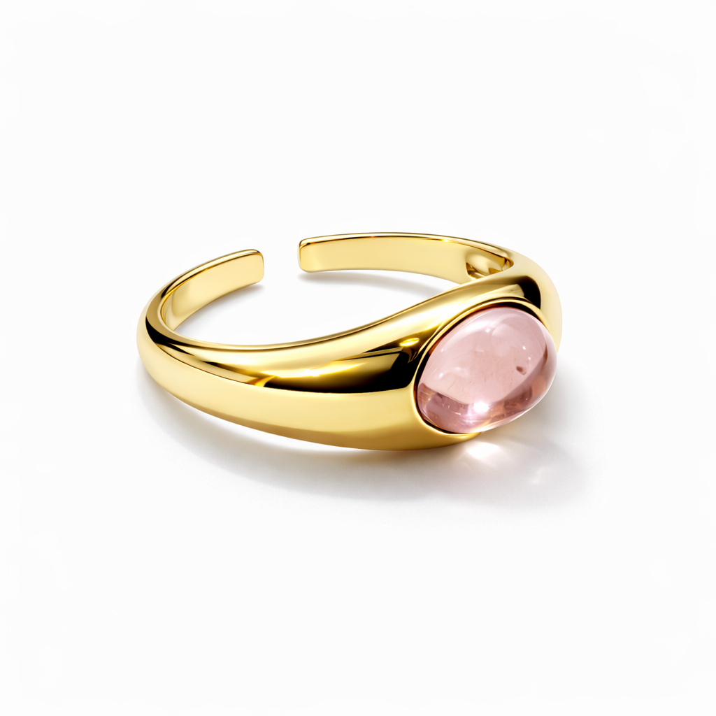 Jinam pink stone statement adjustable gold ring featuring a large pink gemstone and a sleek gold band.