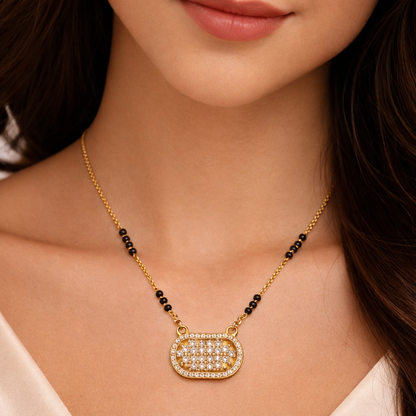 Lattice oval CZ Mangalsutra pendant in gold finish with intricate design, showcasing Jinam's elegant jewelry craftsmanship.