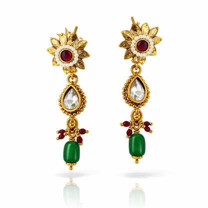 Jinam Floral Grace Ruby Emerald Necklace Set featuring a gold-tone necklace with floral design and gemstone accents.