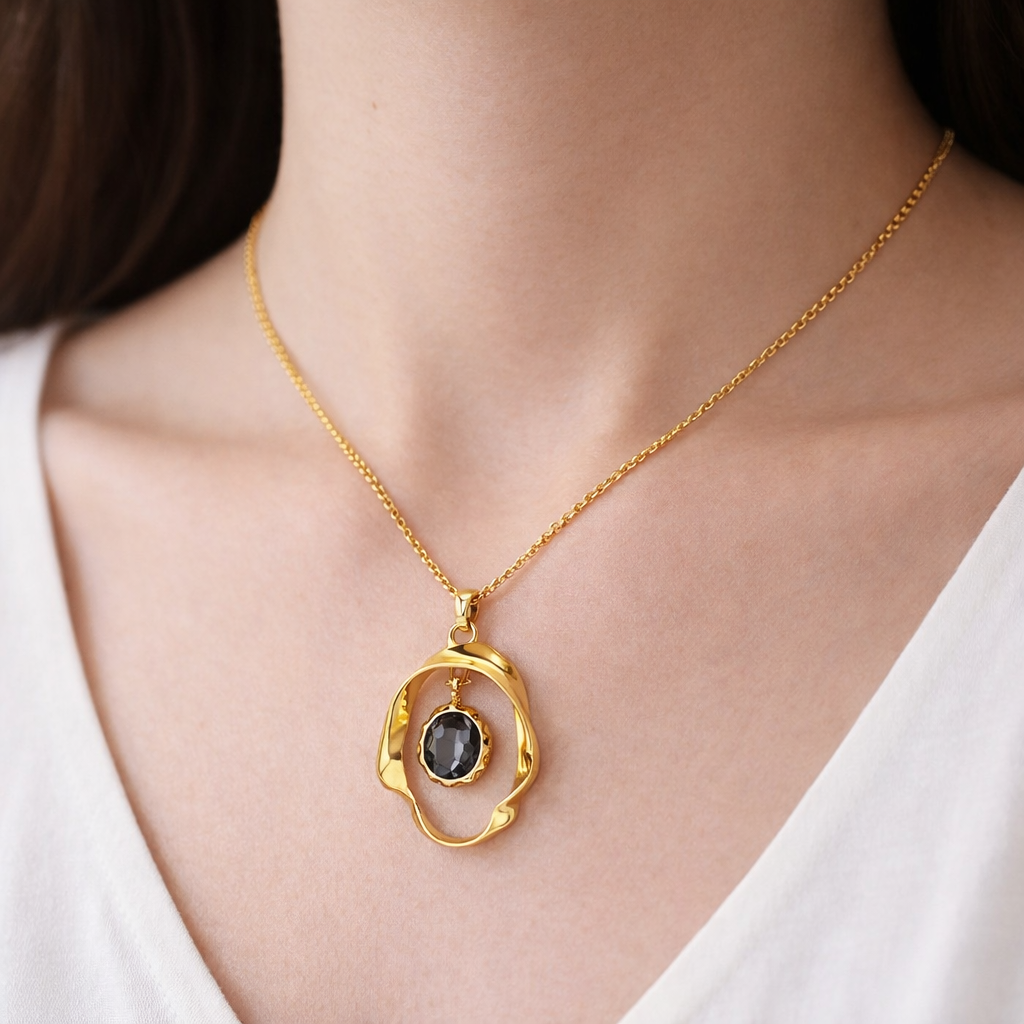 Jinam designer black crystal pendant necklace set with gold plating, anti-tarnish finish, featuring a stylish pendant on a chain.