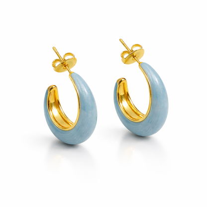 Blue enamel chunky hoop earrings by Jinam featuring bold, round hoops with glossy blue enamel finish.