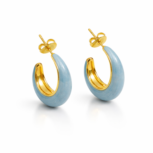 Blue enamel chunky hoop earrings by Jinam featuring bold, round hoops with glossy blue enamel finish.