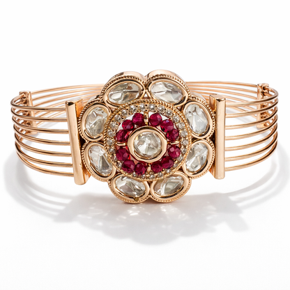Jinam Ruby Kundan adjustable rose gold bracelet featuring intricate design and sparkling red gemstones on a delicate band.