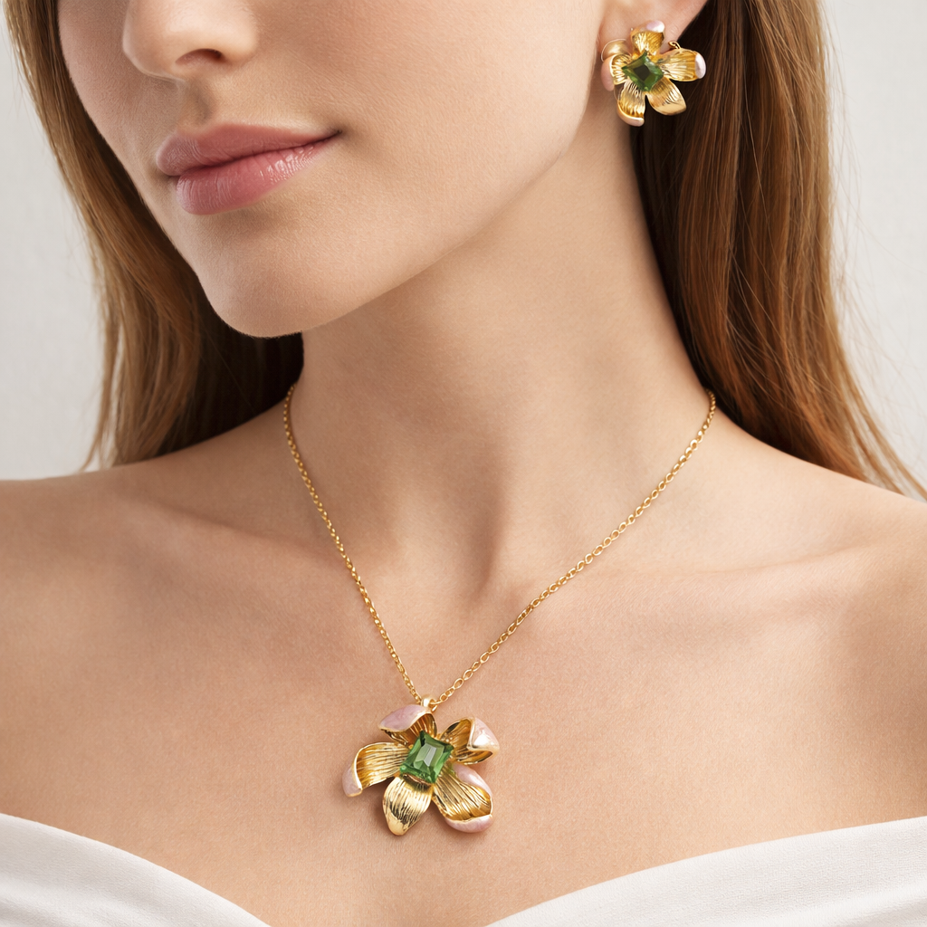 Elegant gold-plated floral pendant jewelry set with green stones from Jinam, featuring a matching necklace and earrings.