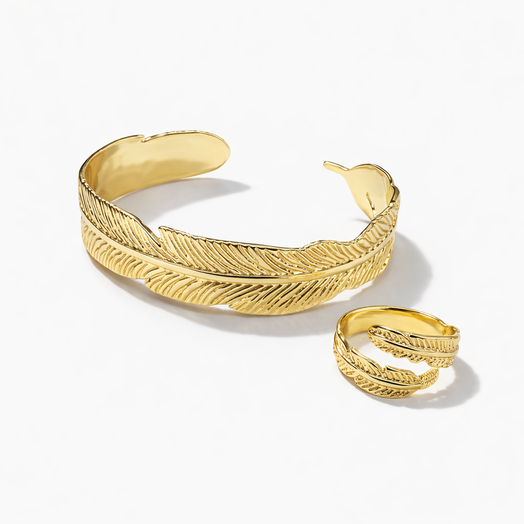 Gold feather bracelet and ring combo by Jinam featuring elegant, nature-inspired jewelry with delicate feather designs.