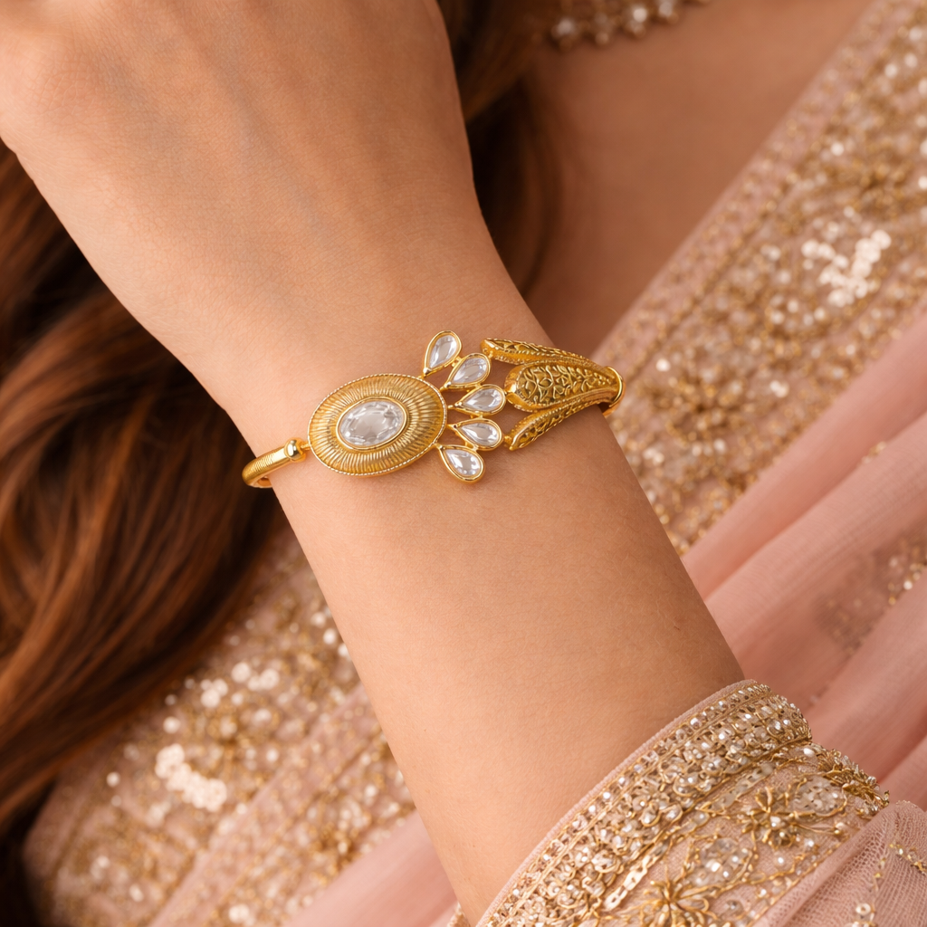 Jinam Royal Kundan Bloom Gold Bracelet with intricate floral design and sparkling gemstone accents.