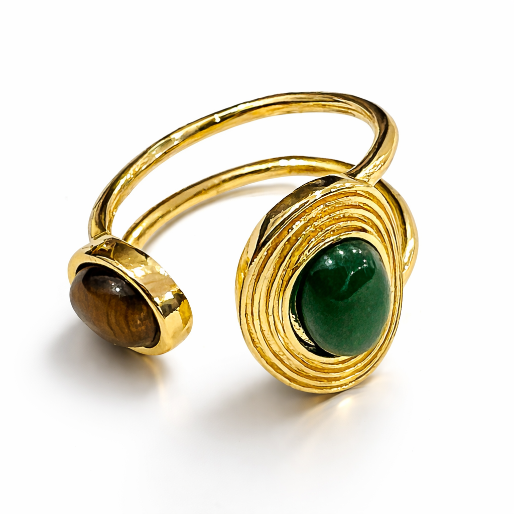 Jinam dual stone open adjustable statement ring with two prominent stones and a sleek metal band on a white background.