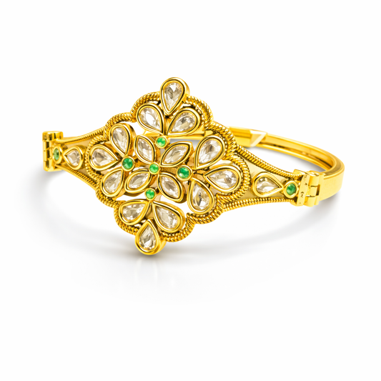 Gold-plated Kundan floral bracelet by Jinam featuring intricate gemstone detailing and elegant floral design.