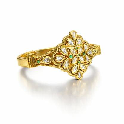 Gold-plated Kundan floral bracelet by Jinam featuring intricate gemstone detailing and elegant design.
