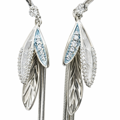 Silver-plated long tassel earrings by Jinam featuring elegant, flowing dangle design with intricate details.