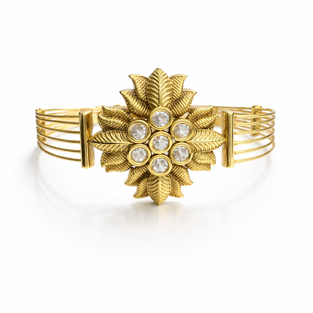 Floral Kundan statement bracelet in antique gold finish with intricate floral design, crafted by Jinam.