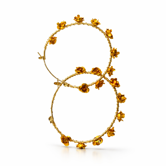Gold-plated floral hoop earrings from Jinam, featuring intricate flower designs on classic round hoops.