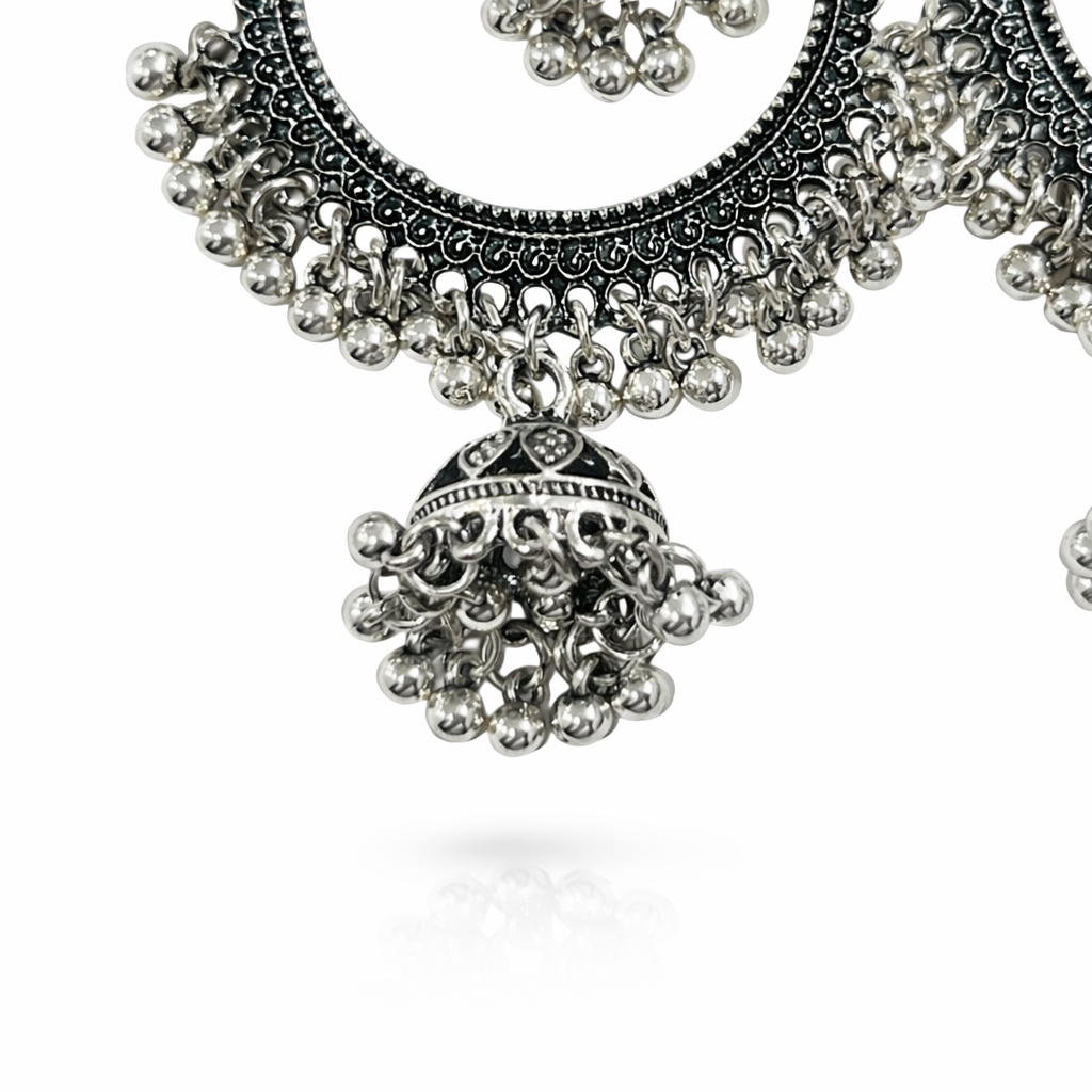 Oxidised silver hoop earrings with dual jhumka design, featuring intricate detailing and traditional craftsmanship by Jinam.