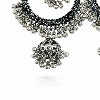 Oxidised silver hoop earrings with dual jhumka design, featuring intricate detailing and traditional craftsmanship by Jinam.
