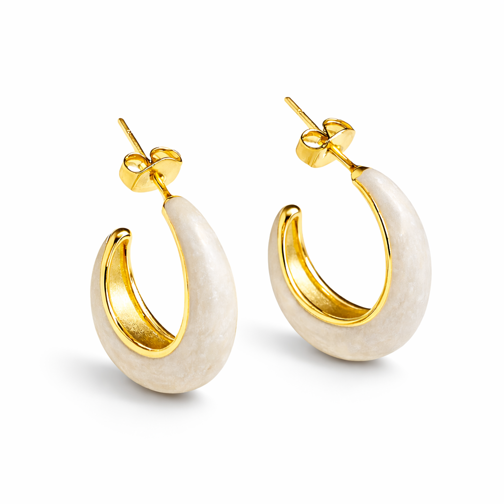 Ivory enamel chunky hoop earrings by Jinam, featuring bold circular design with smooth glossy finish.