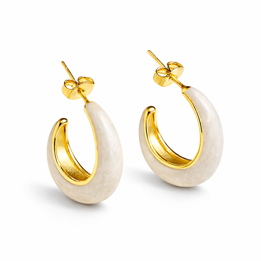Ivory enamel chunky hoop earrings by Jinam, featuring bold circular design with smooth glossy finish.