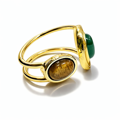 Jinam dual stone open adjustable statement ring with two prominent stones and an open, modern design on a neutral background.